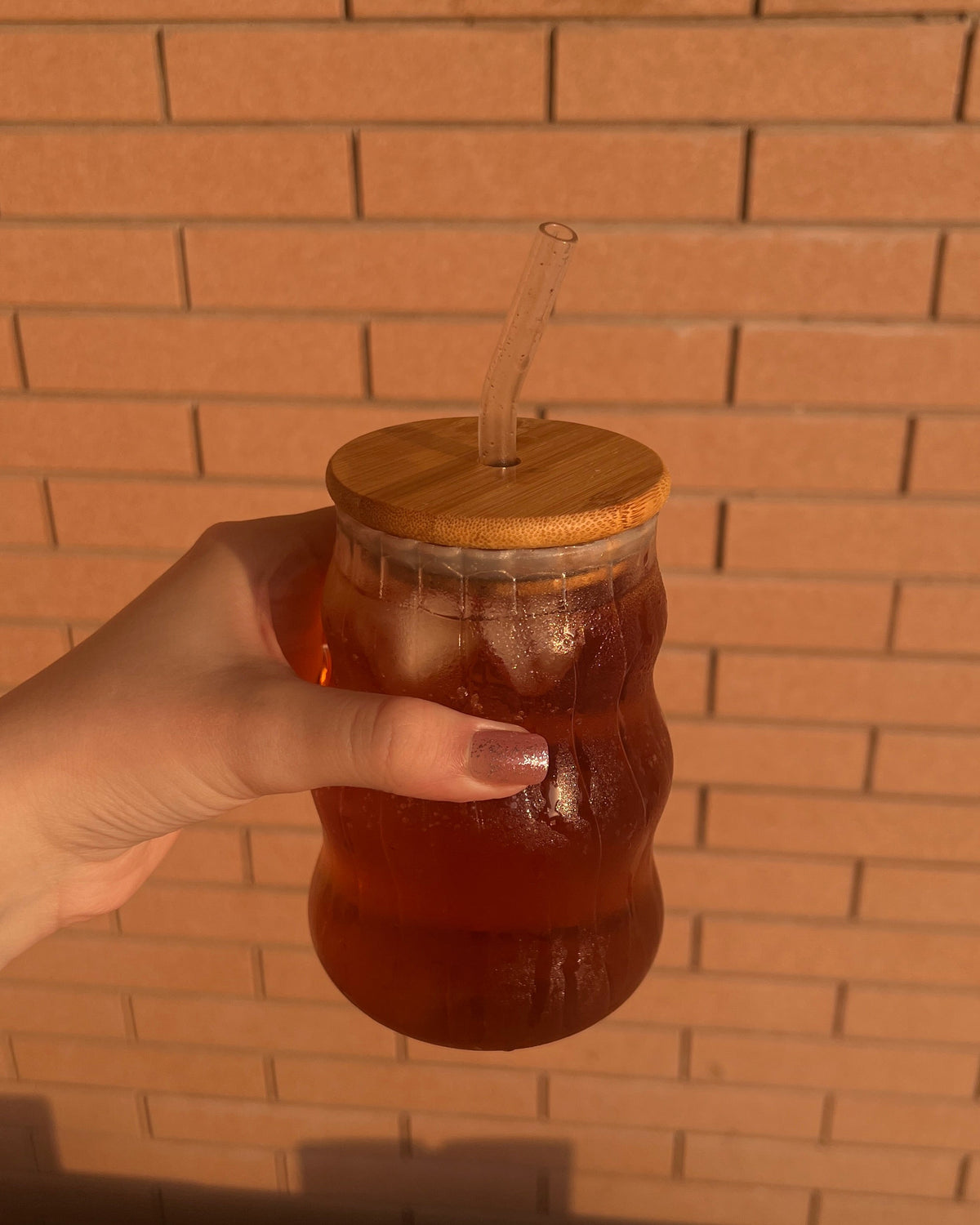 Prepared glass of Khaaspur Gulabi Shaam botanical brew
